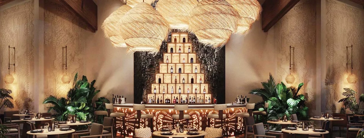 Bar avec comptoir, tables et chaises, ambiance intime, lumière douce