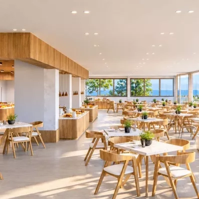 Une grande salle de restaurant lumineuse aux tons clairs et de grande baies vitrées.