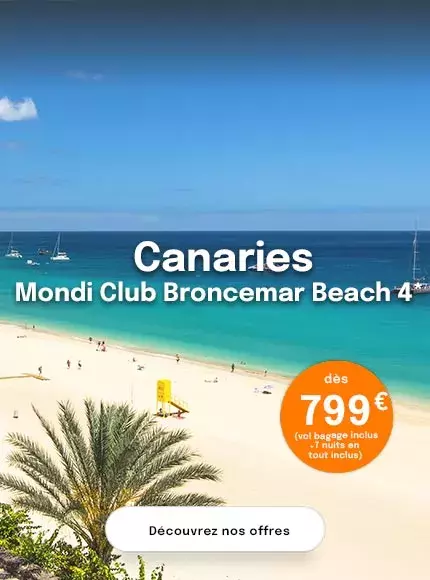 Une plage aux Canaries avec une mer turquoise et du sable blanc et proposant un séjour à partir de 799€