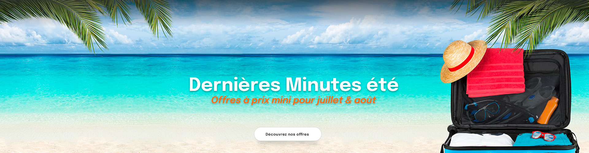 mer turquoise et valise sur sable blanc